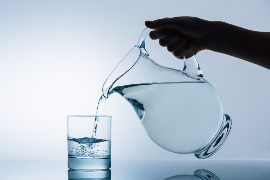 cropped image of woman pouring water from transpar 2024 11 18 05 11 13 utc