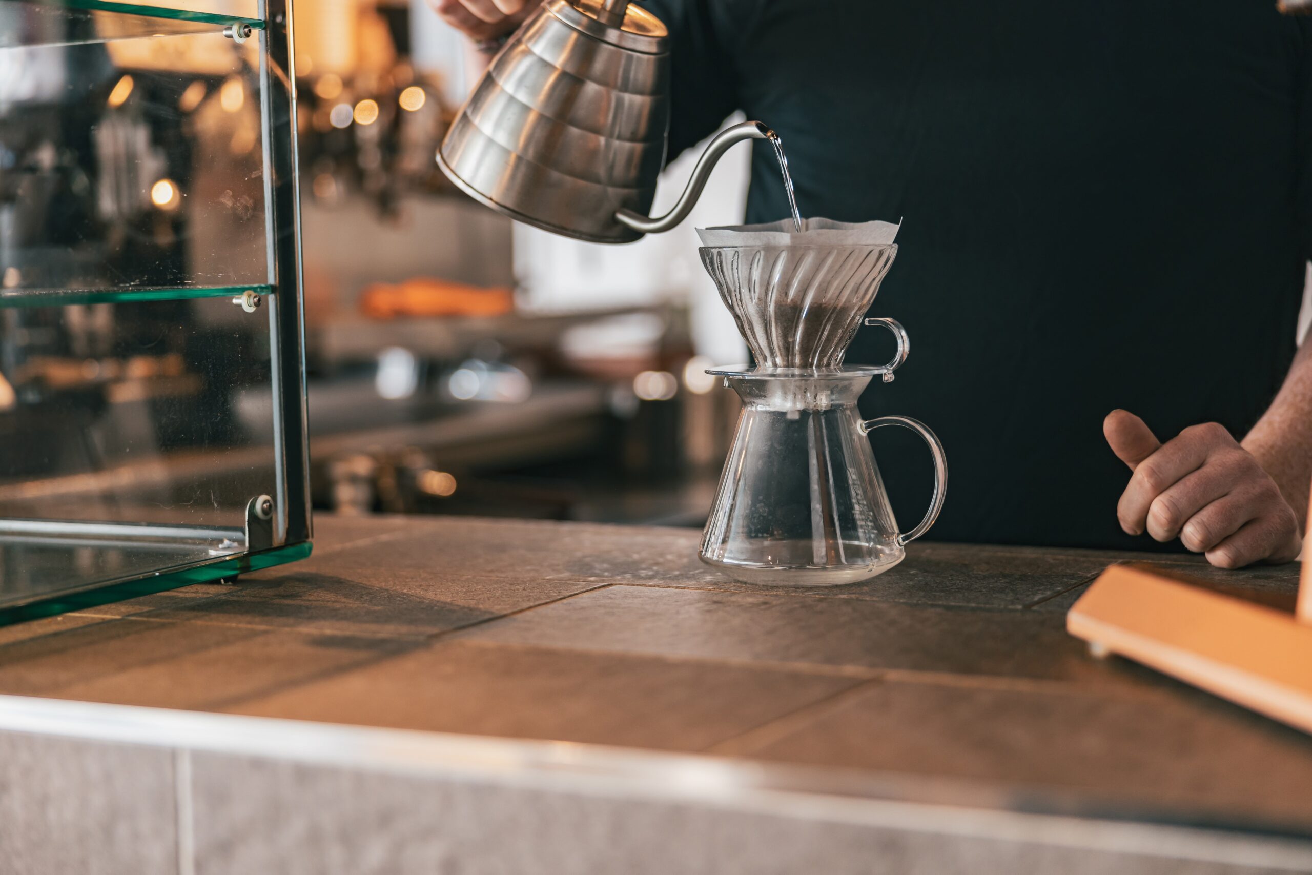 hand drip coffee barista pouring water on coffee 2025 03 13 12 16 06 utc 1 scaled
